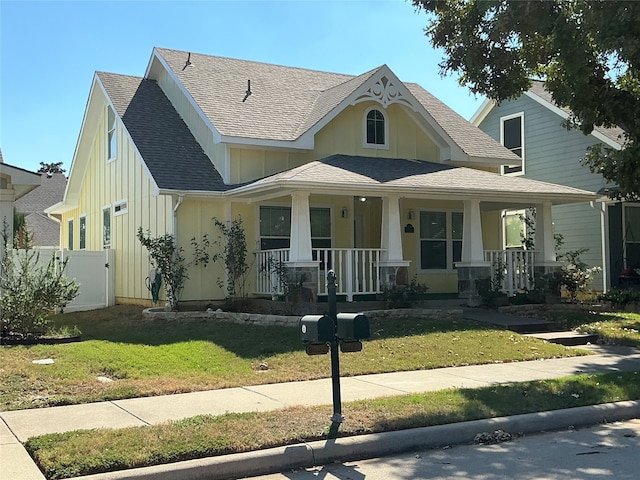 view of front of home featuring a front yard and a porch