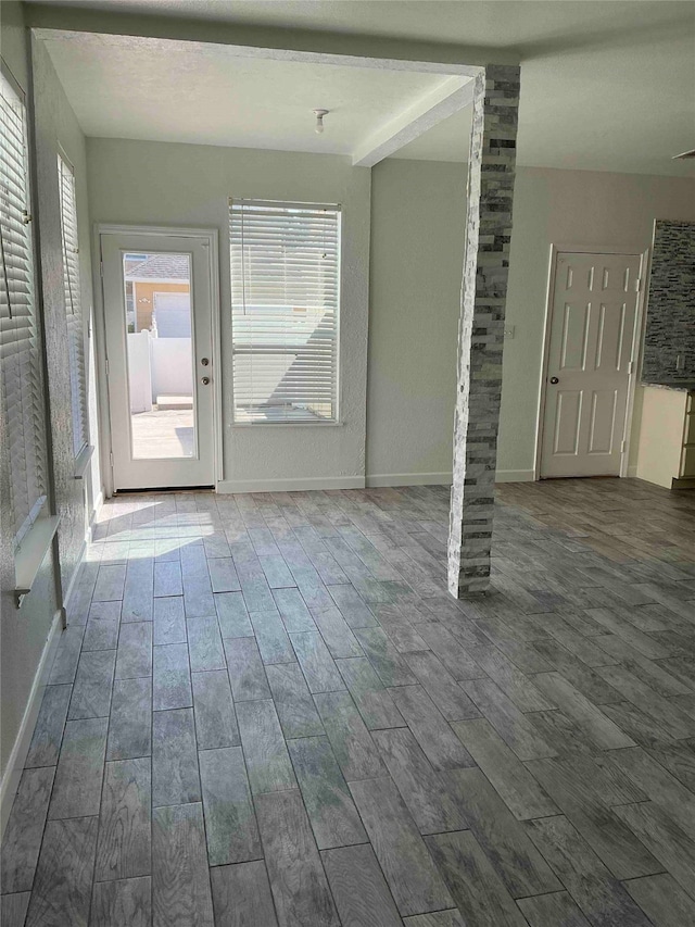 unfurnished room featuring hardwood / wood-style floors