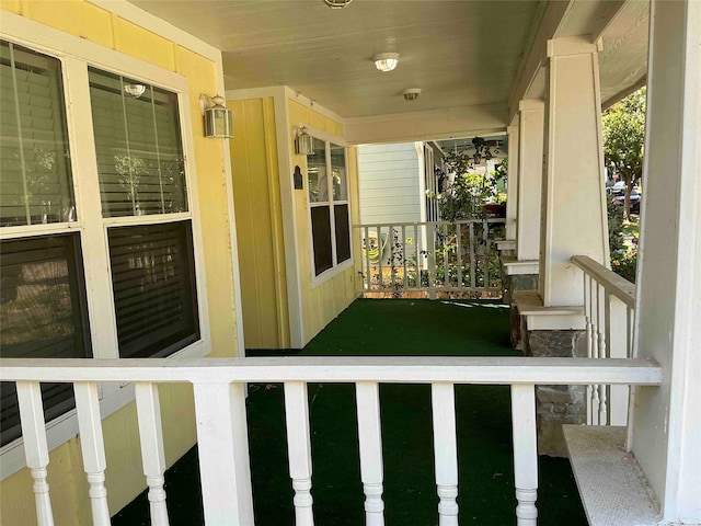 view of yard featuring covered porch