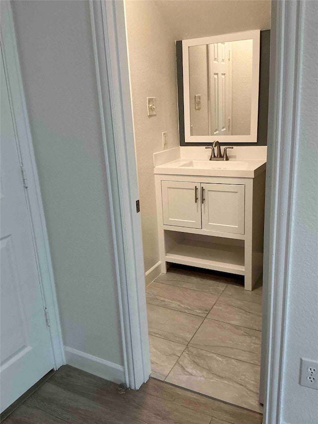 bathroom featuring hardwood / wood-style flooring and vanity