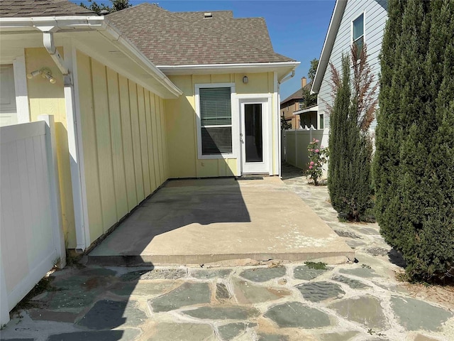 view of exterior entry featuring a patio area