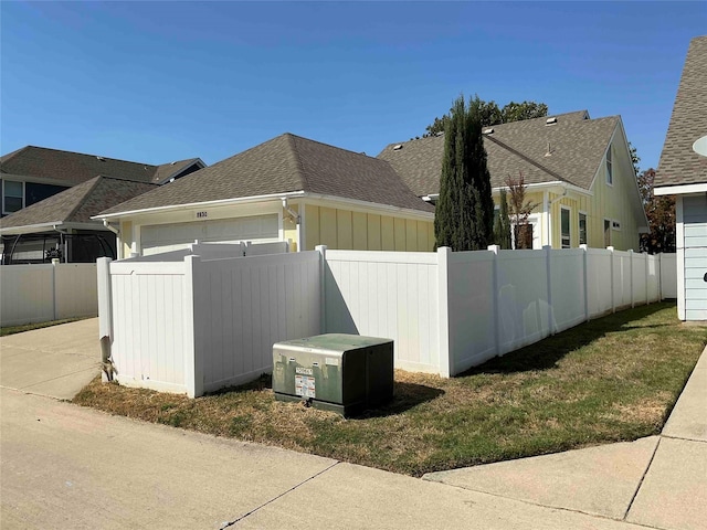 view of side of property with a yard