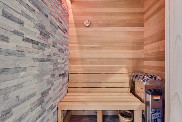 view of sauna featuring wood walls