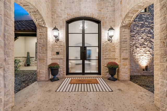 exterior entry at dusk with french doors