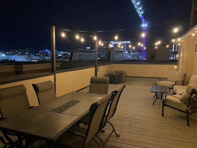 deck at night with outdoor lounge area