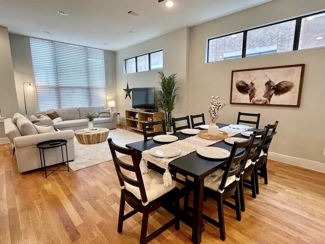 dining space featuring light hardwood / wood-style flooring