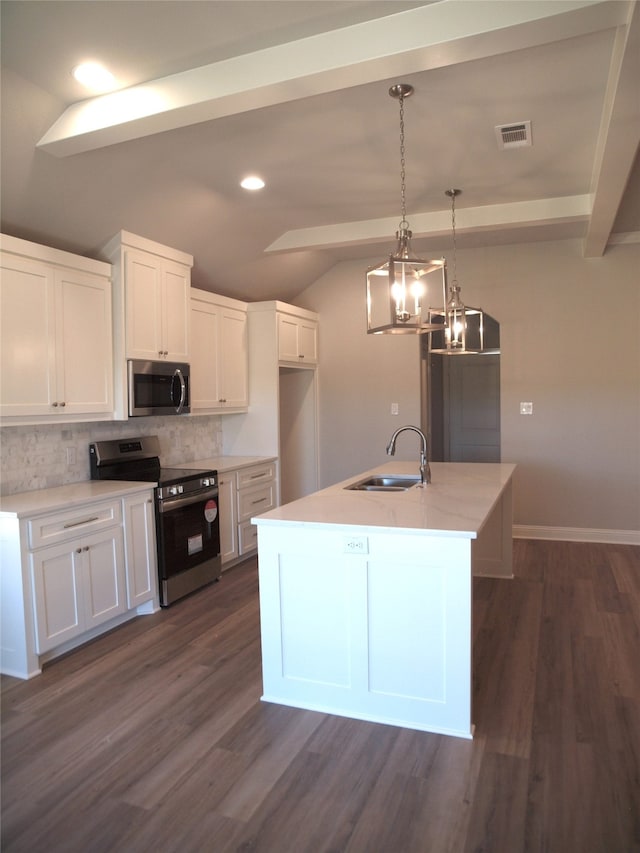 kitchen with white cabinetry, appliances with stainless steel finishes, dark wood-type flooring, and sink