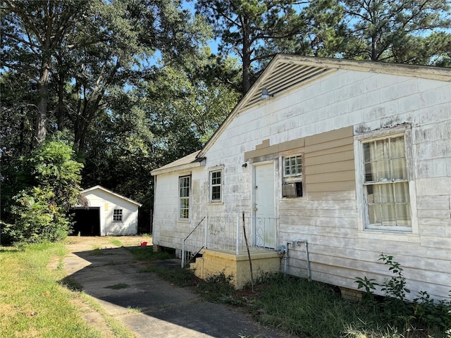 view of home's exterior featuring a storage shed