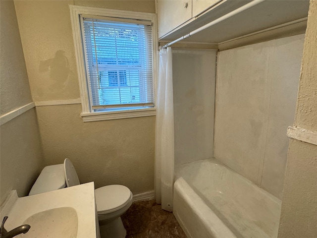 full bathroom featuring shower / bath combo, vanity, and toilet