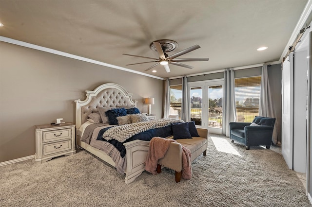 carpeted bedroom featuring ceiling fan, a barn door, and ornamental molding