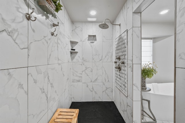 bathroom featuring shower with separate bathtub