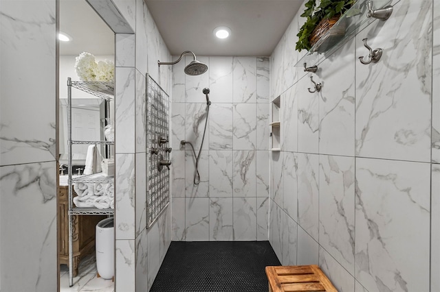 bathroom with tiled shower