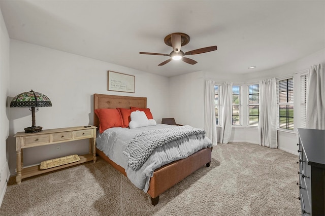 bedroom featuring ceiling fan and light colored carpet