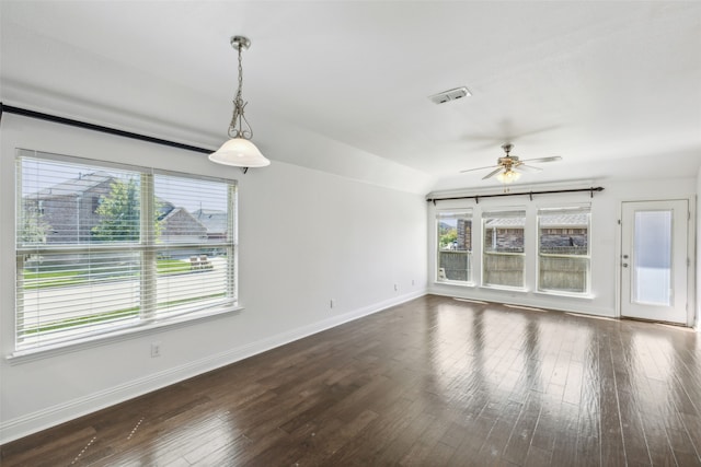 interior space with lofted ceiling, ceiling fan, and dark hardwood / wood-style flooring