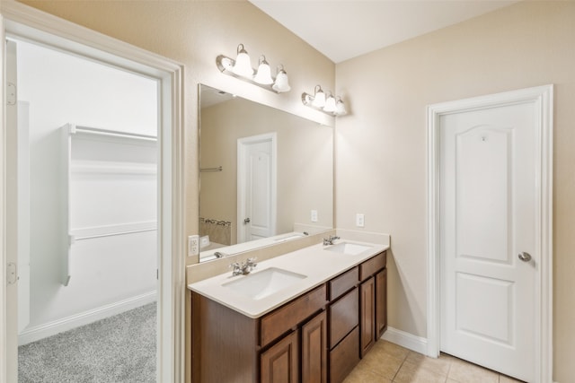 bathroom with tile patterned flooring and vanity