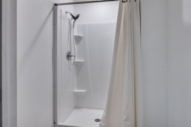 bathroom with a shower with shower curtain