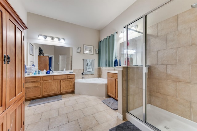 bathroom featuring vanity, tile patterned flooring, and plus walk in shower