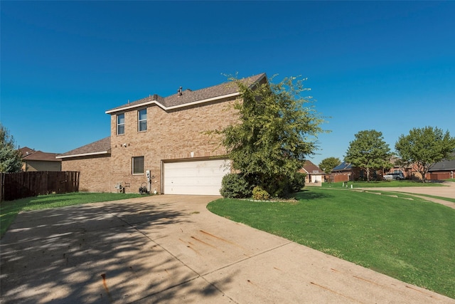 exterior space with a front yard and a garage