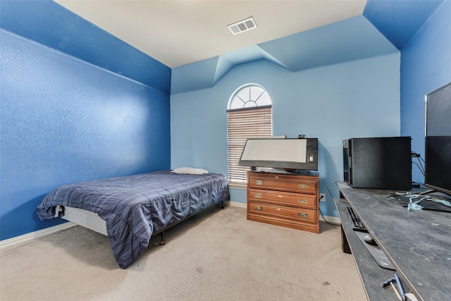 carpeted bedroom featuring lofted ceiling