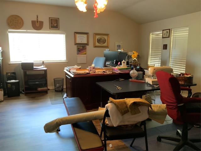 office space with vaulted ceiling and hardwood / wood-style floors