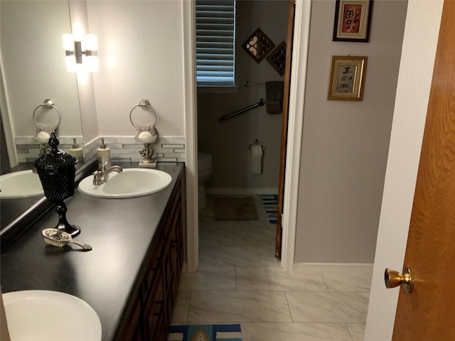 bathroom with vanity and toilet