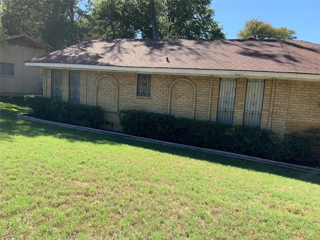 view of home's exterior featuring a yard