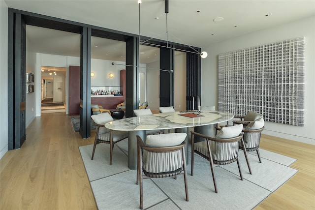 dining room with light hardwood / wood-style flooring