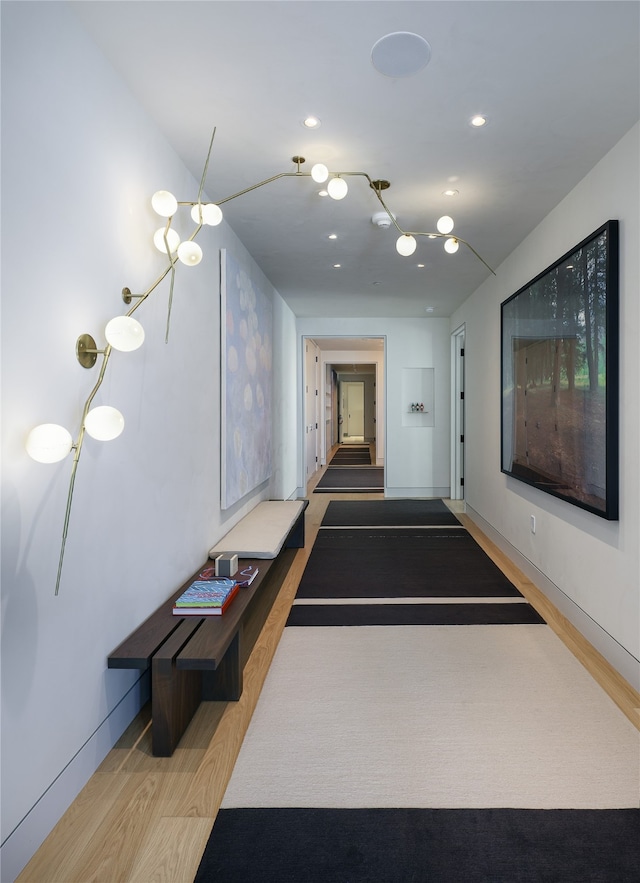 hallway with hardwood / wood-style floors