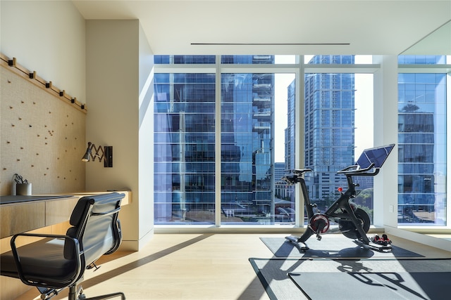 interior space featuring wood-type flooring and floor to ceiling windows