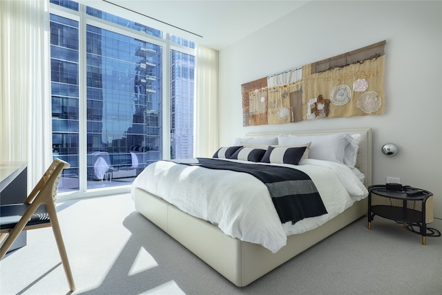 carpeted bedroom featuring multiple windows