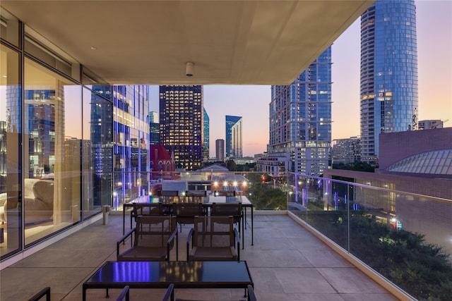 patio terrace at dusk with a balcony