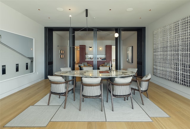 dining area with light hardwood / wood-style flooring