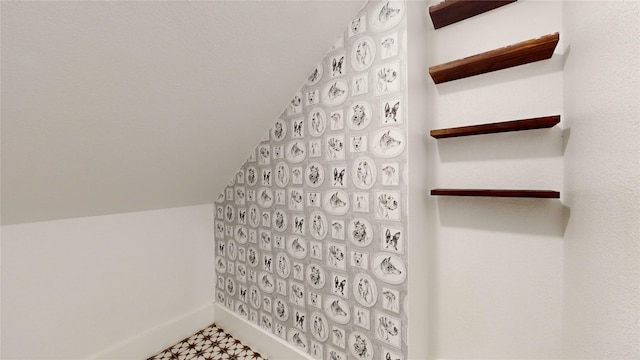 bathroom featuring vaulted ceiling