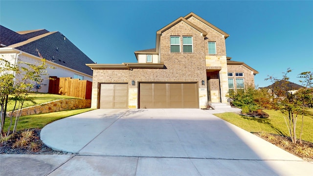 view of front property with a garage and a front yard