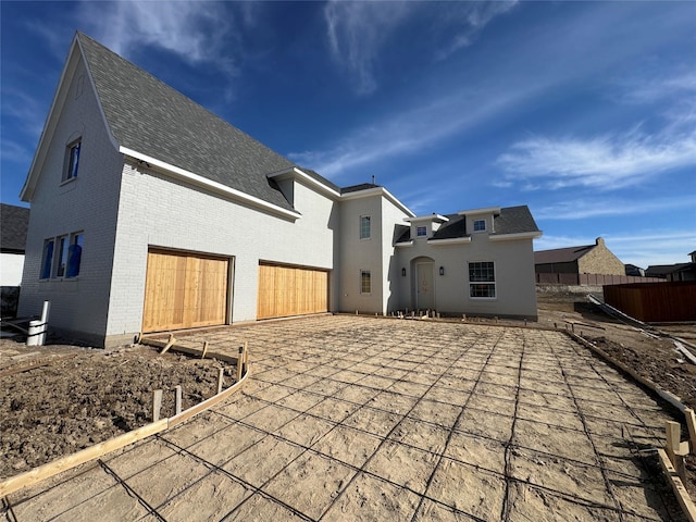 back of house with a garage