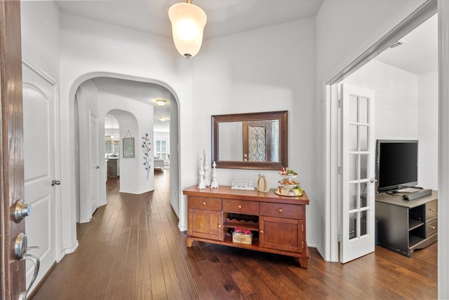 corridor featuring dark hardwood / wood-style floors