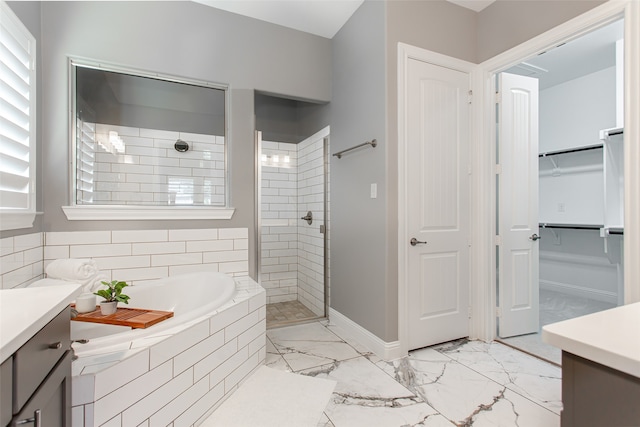 bathroom featuring vanity and separate shower and tub