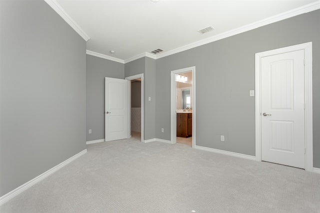 unfurnished bedroom with light colored carpet, ensuite bathroom, and crown molding