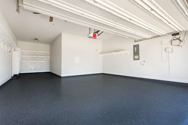 garage featuring electric panel and a garage door opener