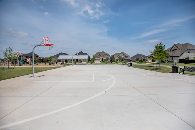 view of sport court with a playground