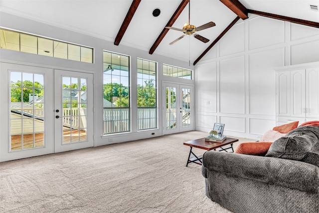 sunroom with french doors, lofted ceiling with beams, and ceiling fan