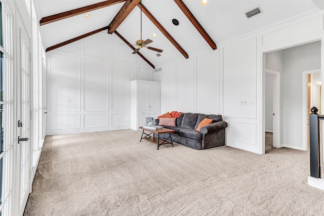 living room with ceiling fan, light colored carpet, beam ceiling, and high vaulted ceiling