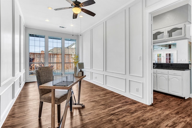 office space featuring ceiling fan and dark hardwood / wood-style flooring