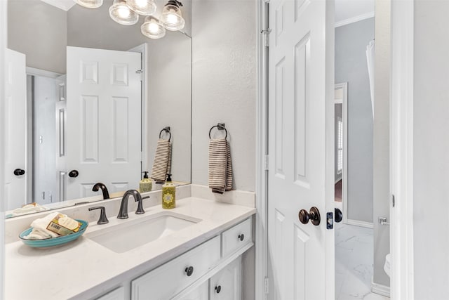 bathroom with vanity and crown molding