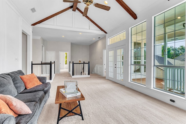 living room featuring french doors, light colored carpet, high vaulted ceiling, ceiling fan, and beam ceiling