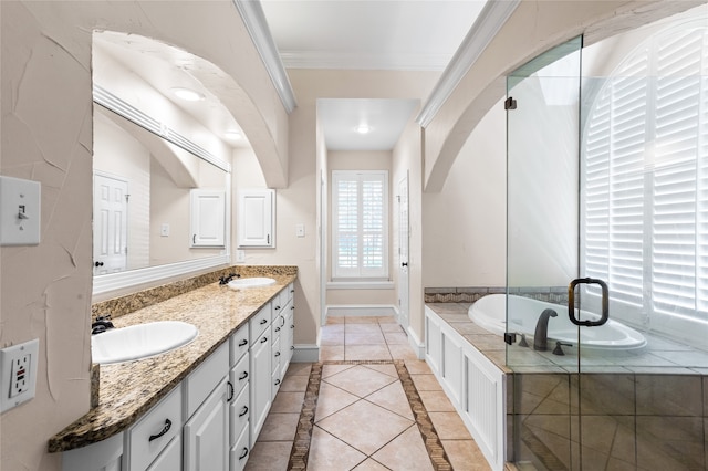 bathroom with ornamental molding, vanity, separate shower and tub, and tile patterned floors