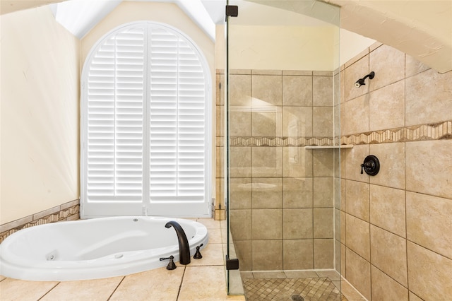 bathroom featuring shower with separate bathtub