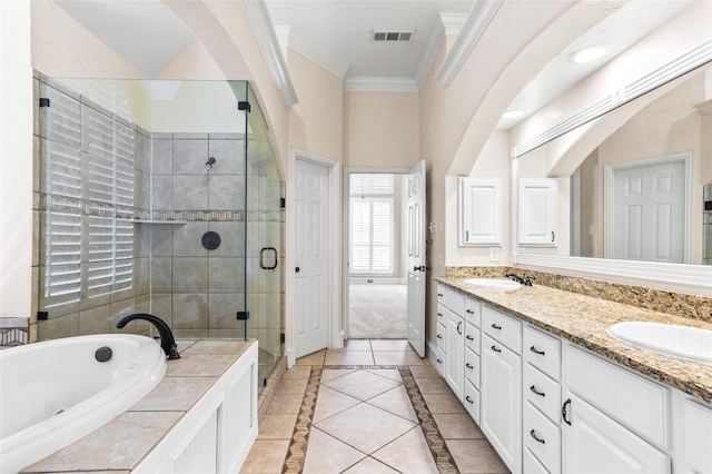 bathroom featuring crown molding, vanity, plus walk in shower, and tile patterned floors