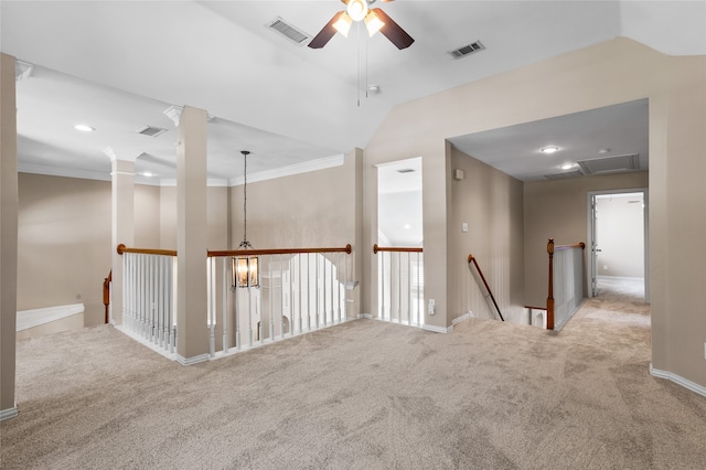 spare room with ceiling fan, light colored carpet, lofted ceiling, and ornamental molding