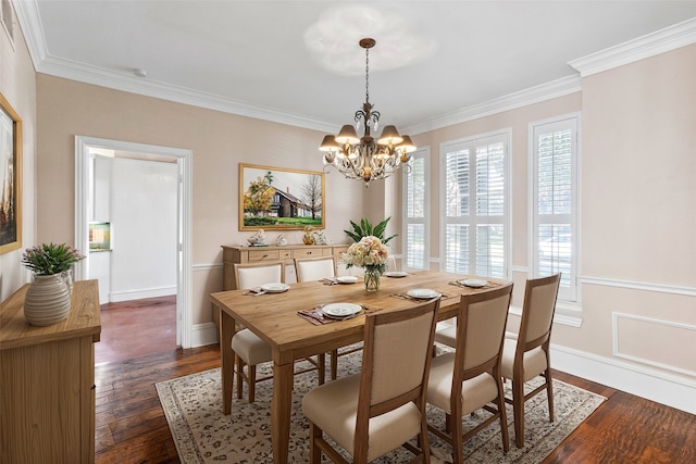 dining space with ornamental molding, an inviting chandelier, and dark hardwood / wood-style flooring